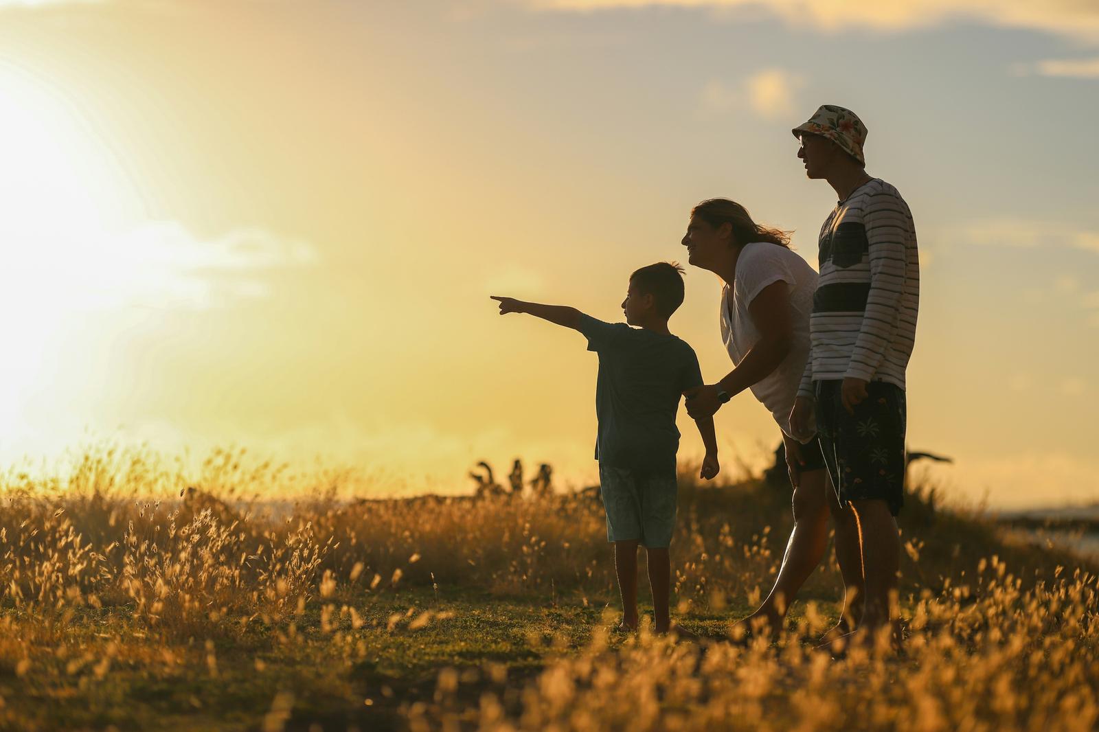 Family silhouette at sunset