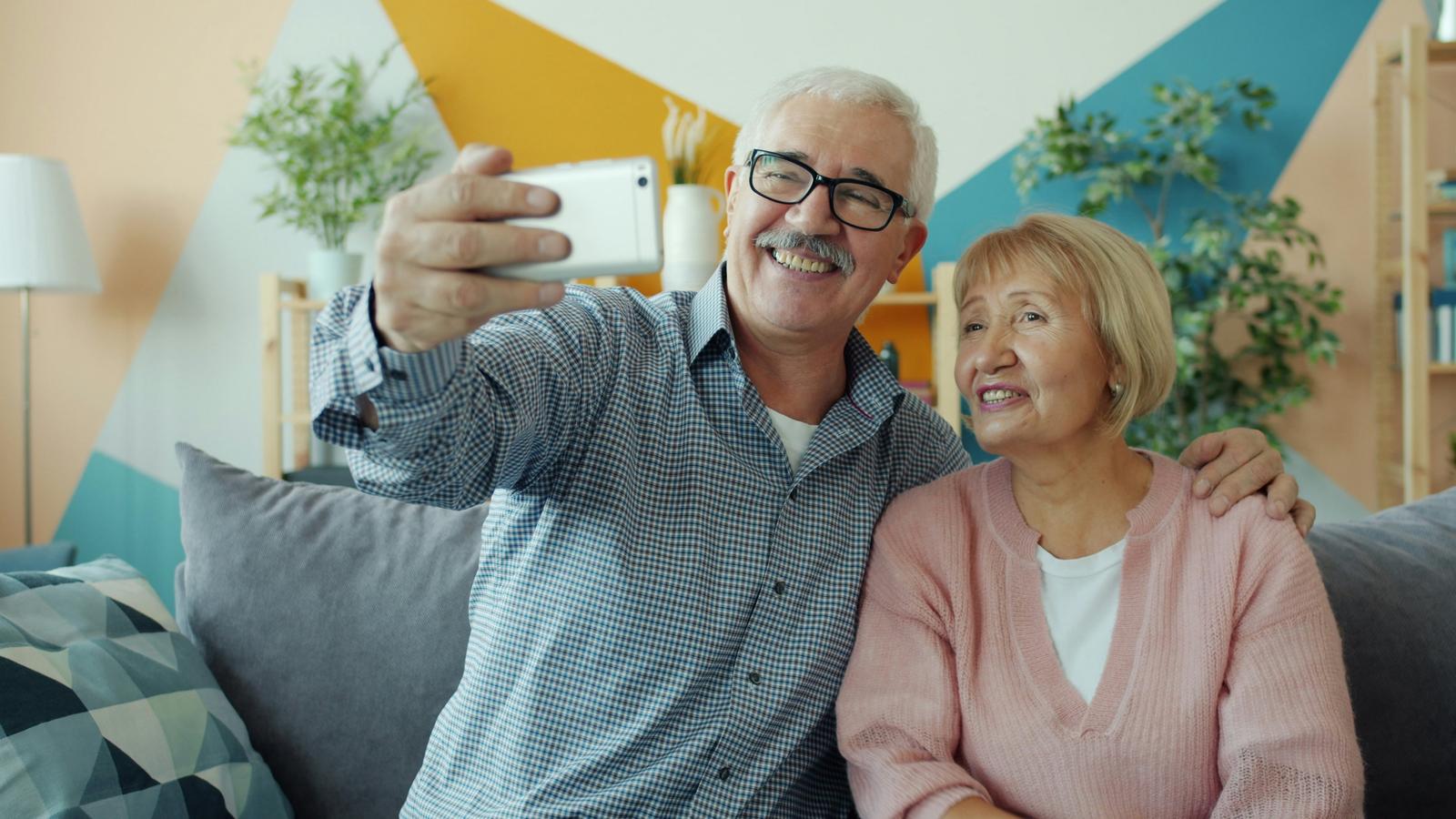 Elderly couple using technology together